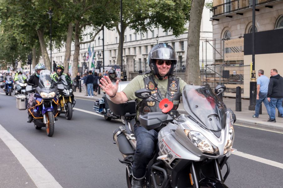 A group of motorcyclists riding their motorcycles on a highway.