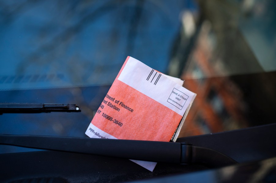 A parking ticket on the windshield of a vehicle in New York City