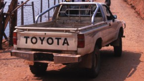 A white 1986 Toyota Pickup truck