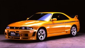 A yellow-with-black-emblems 1996 R33 Nissan Skyline GT-R Nismo 400R