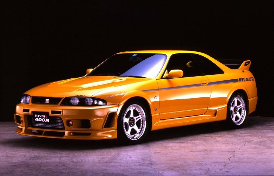 A yellow-with-black-emblems 1996 R33 Nissan Skyline GT-R Nismo 400R