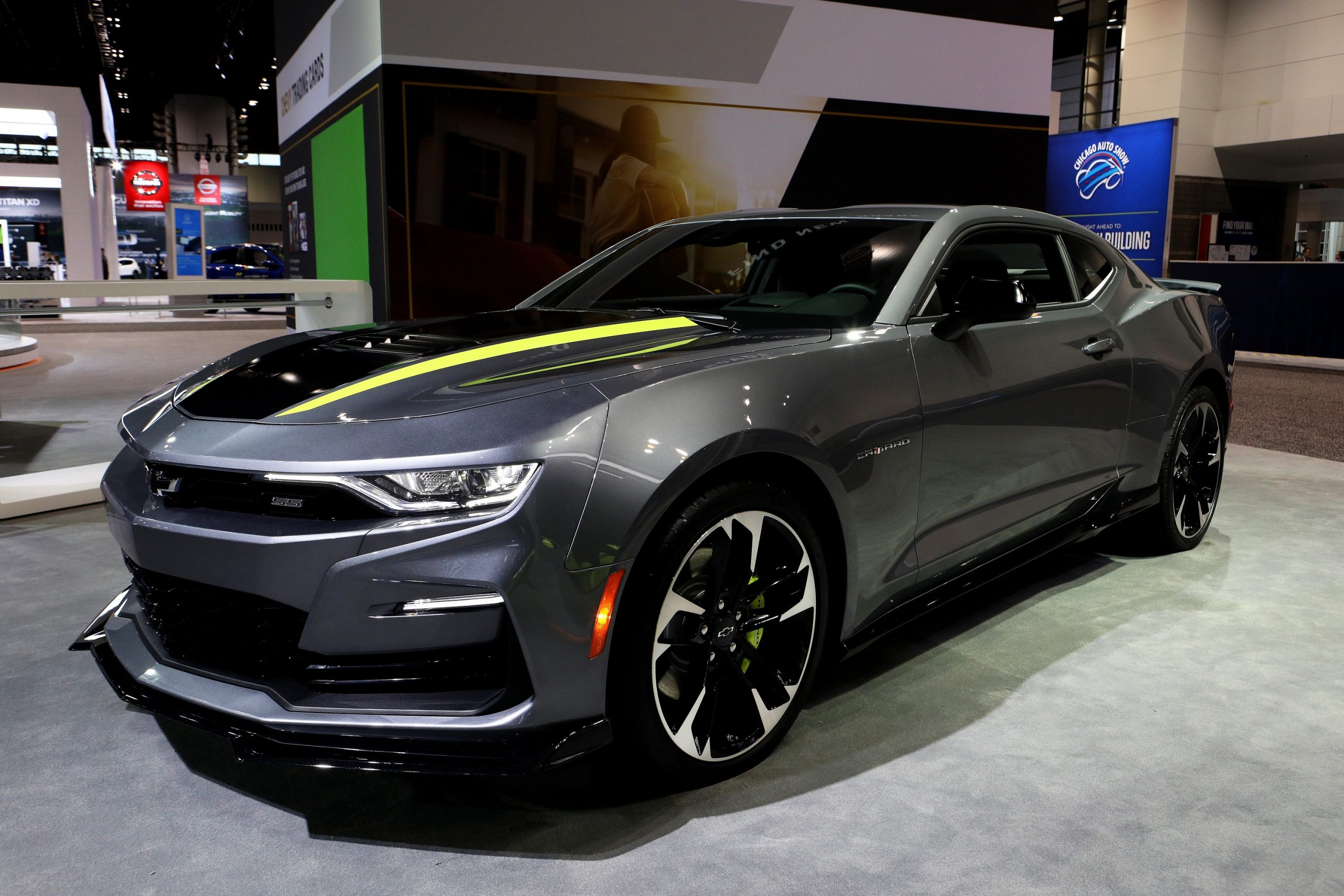 A grey Chevrolet Camaro shot from the 3/4 angle at an auto show