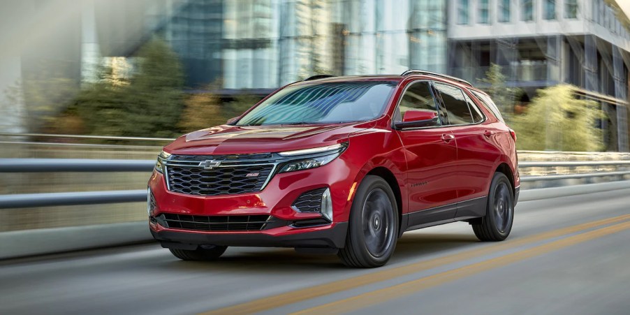 A red 2022 Chevrolet Equinox driving on the road