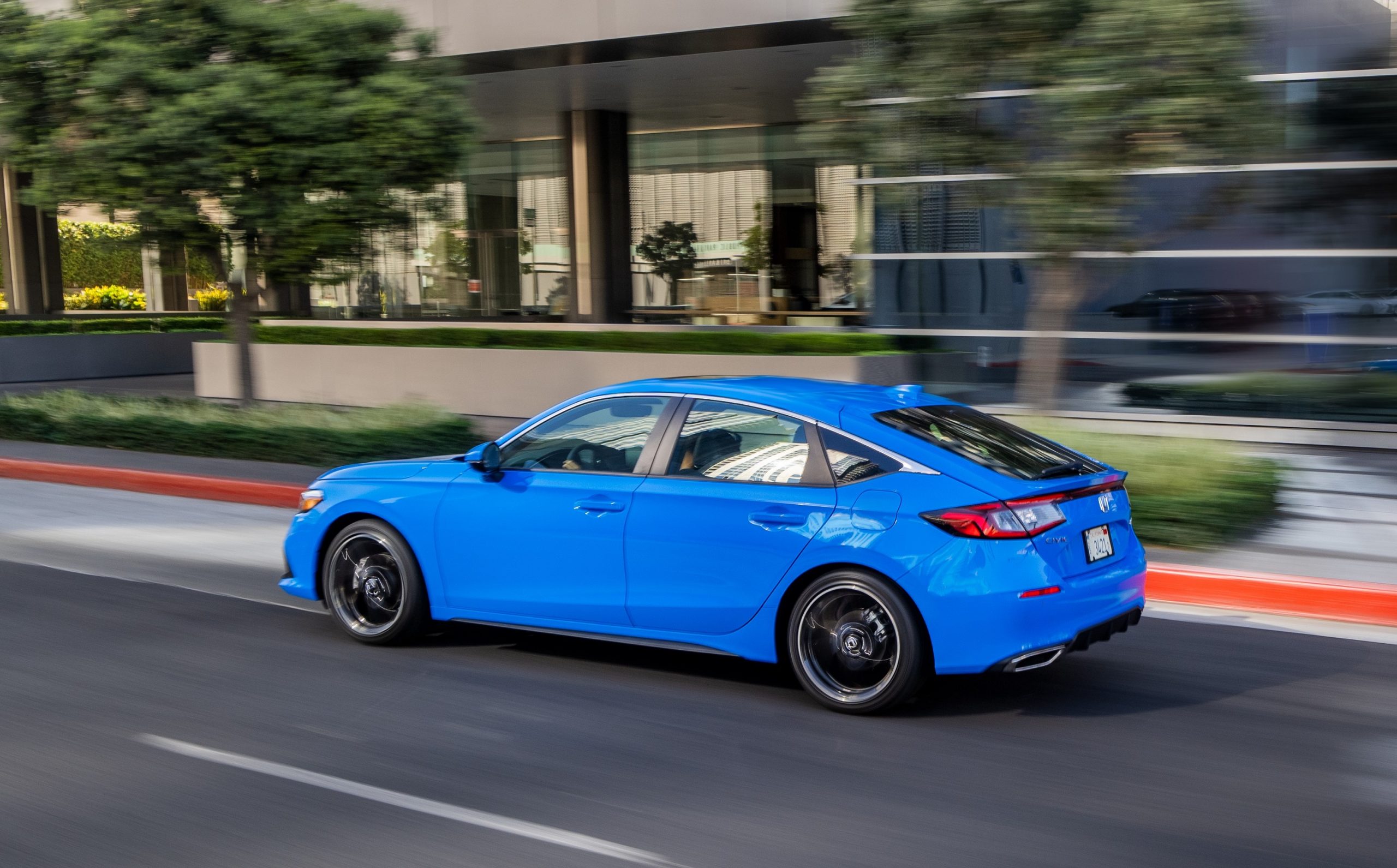 The rear of the Honda Civic hatch, shot in motion from profile