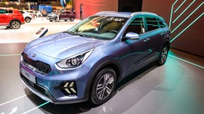 A blue 2022 Kia Niro SUV is on display.