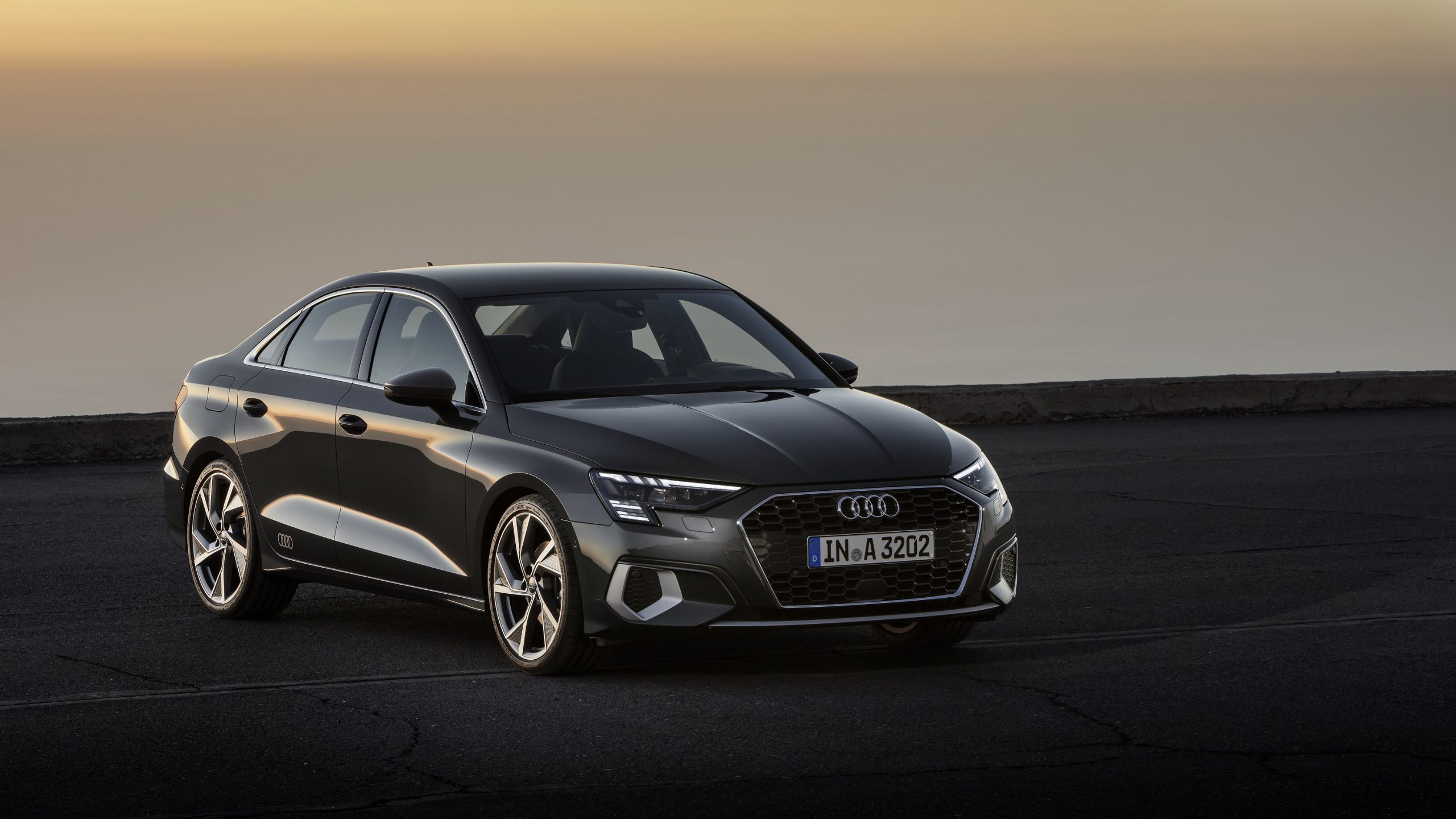 A grey 2022 Audi A3 shot at sunset from the 3/4 angle