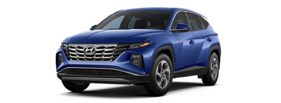 A blue 2022 Hyundai Tucson against a white background.