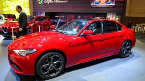 The Alfa Romeo Giulia luxury sports sedan in red at the Brussels Expo in Belgium