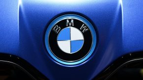 BMW logo on the front of a blue car.