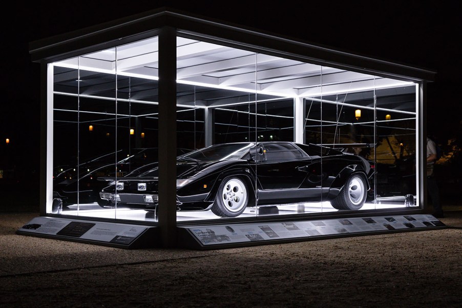 The 1979 Lamborghini Countach from the film "The Cannonball Run" on display at the National Mall at night in a special glass display case to celebrate its inclusion in the National Historic Vehicle Register