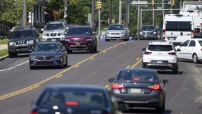 Cars Driving In Traffic On City Street