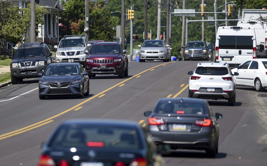 Cars Driving In Traffic On City Street