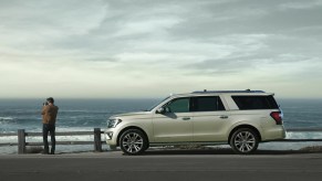 A beige 2021 Ford Expedition parked at the beach.