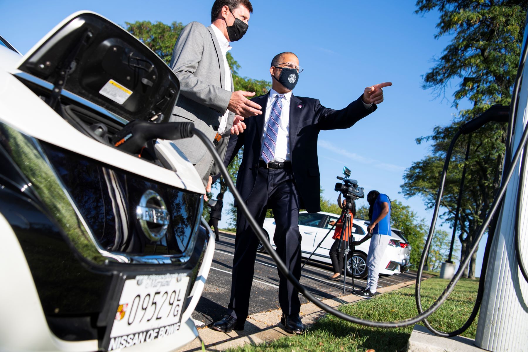 A Nissan Leaf being charged in Maryland by Rep. Anthony Brown and CEO of Washington Area New Dealers Association John O'Donnell