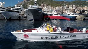 A boat with Electric on the side on the water.