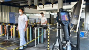 An FCA factory checking the temperatures of employees as they enter the facility. Ford, General Motors, and Stellantis all announced that they would enact a vaccine mandate in their Canadian facilities starting this year.