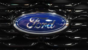 Blue and chrome Ford logo on a black grille.