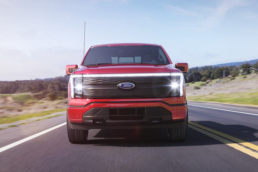 Front view of red 2022 Ford F-150 Lightning electric pickup truck