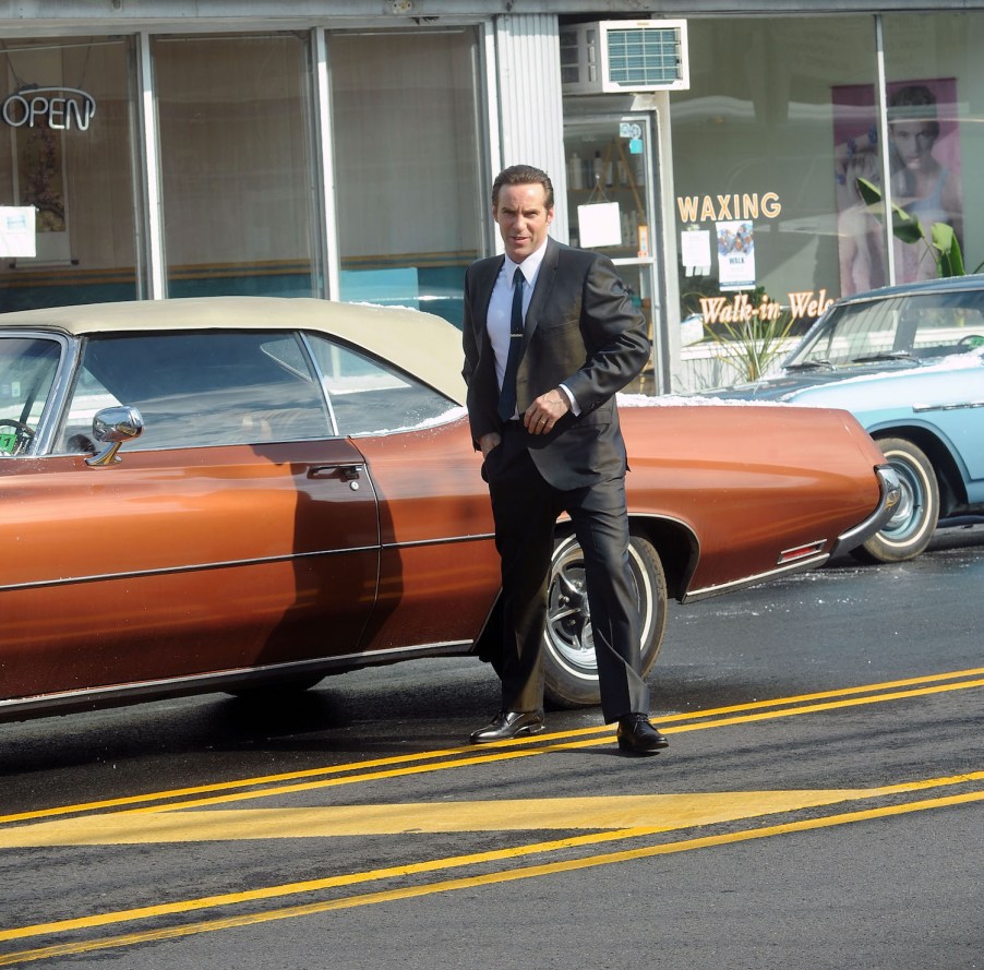 1971 Buick Centurion and actor Alessandro Nivola on the set. This is one of Dickie Moltisanti’s Cars in the Many Saints of Newark Sopranos Prequel | Bobby Bank/GC Images