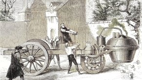 This is an illustration of Nicola-Joseph Cugnot testing his steam car in 1770 | Hulton Archive. the first car was made in 1769. The steam powered military transport predated the Benz patent Motorwagen by a hundred years. | Hulton Archvie / Stringer / Getty Images