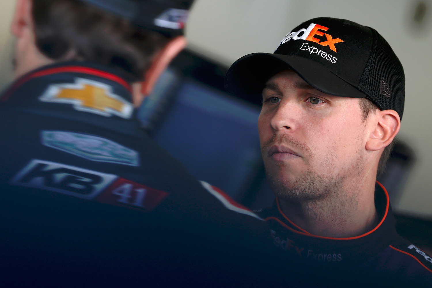 Denny Hamlin, driver of the #11 FedEx Express Toyota, talks with Kurt Busch, driver of the #41 Haas Automation/Monster Energy Chevrolet, in the garage area during practice for the NASCAR Sprint Cup Series Daytona 500 at Daytona International Speedway on February 13, 2016 in Daytona Beach, Florida. Here's What Drivers Are Saying About NASCAR's Next Gen Cars | Brian Lawdermilk/Getty Images