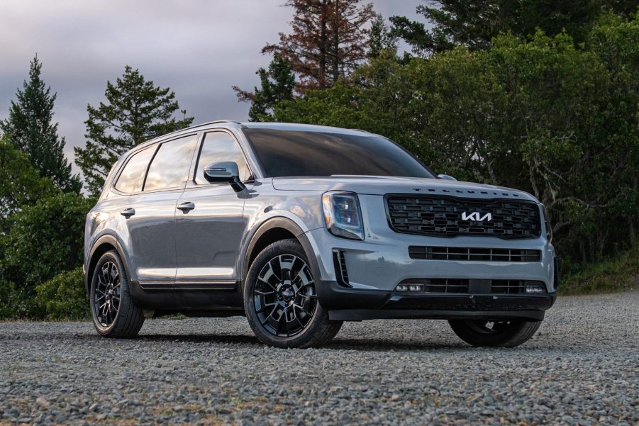 Everlasting Silver 2022 Kia Telluride parked in front of a forest