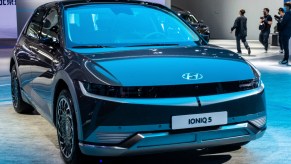 A black Hyundai Ioniq 5 electric SUV is on display.