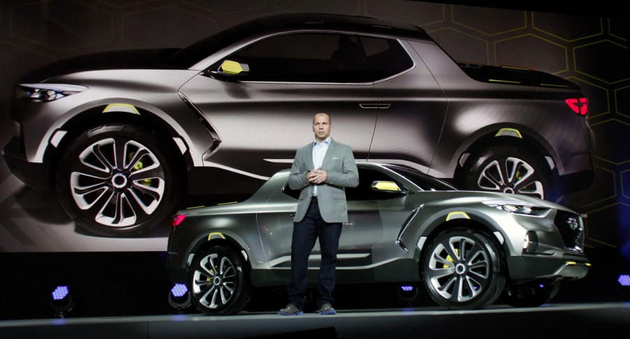 Hyundai Motors America Director of Corporate Planning, reveals a silver Hyundai Santa Cruz concept to the media at the 2015 North American International Auto Show (NAIAS) on January 12, 2015 in Detroit, Michigan.