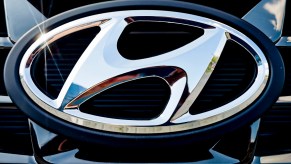 A chrome Hyundai logo on a black grille.