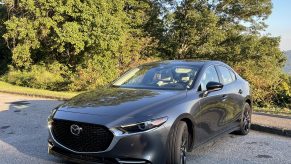 The 2021 Mazda3 Turbo parked in front of a mountain view