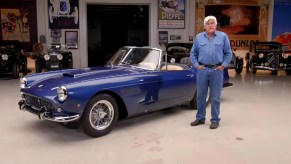 Jay Leno with a blue 1960 Ferrari 250 GT Pinin Farina Cabriolet Series II