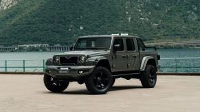 MILITEM-FEROX-T fully modified Jeep Gladiator parked by a body of water