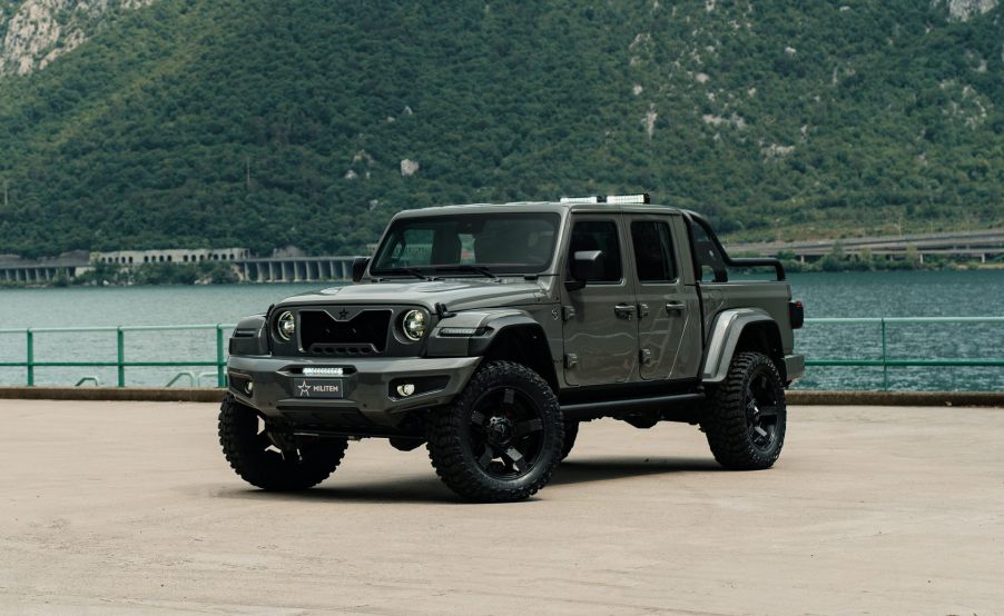 MILITEM-FEROX-T fully modified Jeep Gladiator parked by a body of water