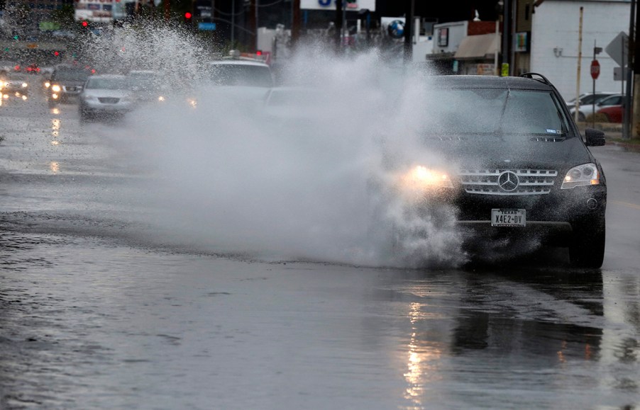 Mercedes Benz driving in the the rain. AAA recently revealed that driver assistance technology can be impaired by rain.