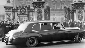 John Lennon's Rolls-Royce Phantom V approaches the gates of Buckingham Palace