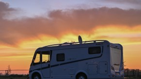 An RV parked at dawn