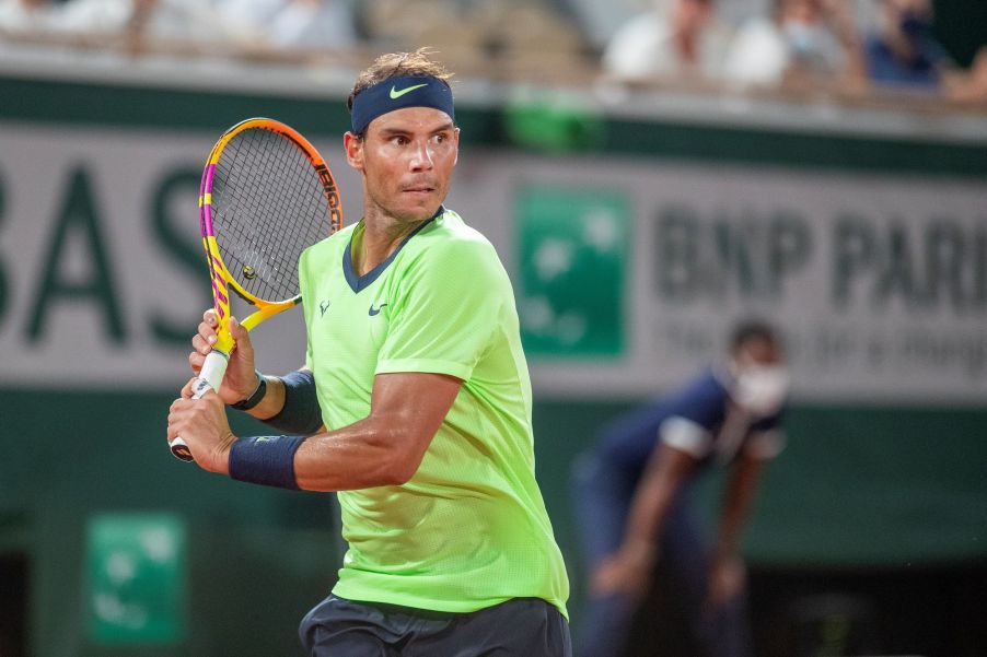 Rafael Nadal playing tennis.