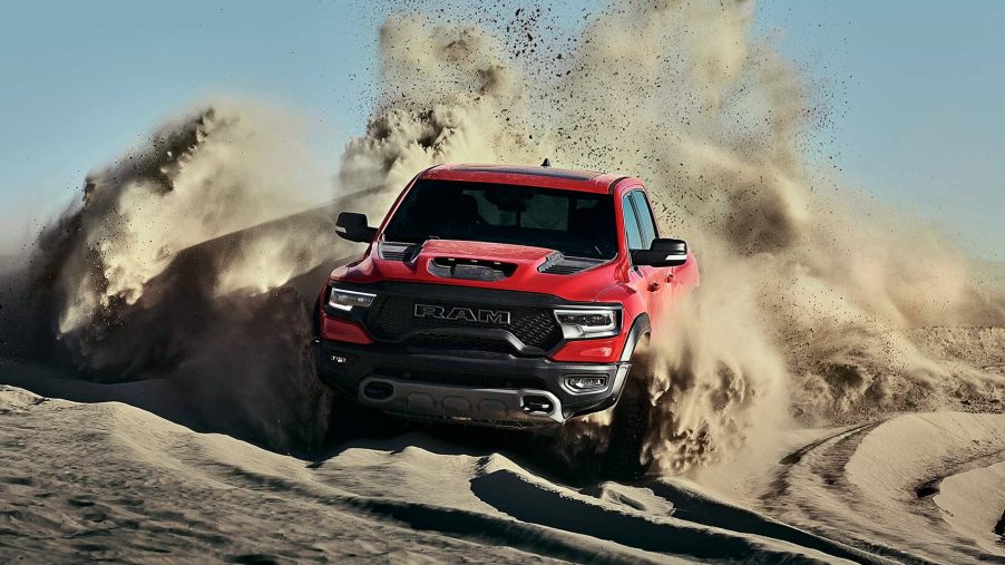 Red 2021 Ram 1500 TRX driving on sandy terrain