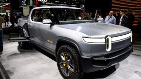 A silver Rivian R1T inside a building.