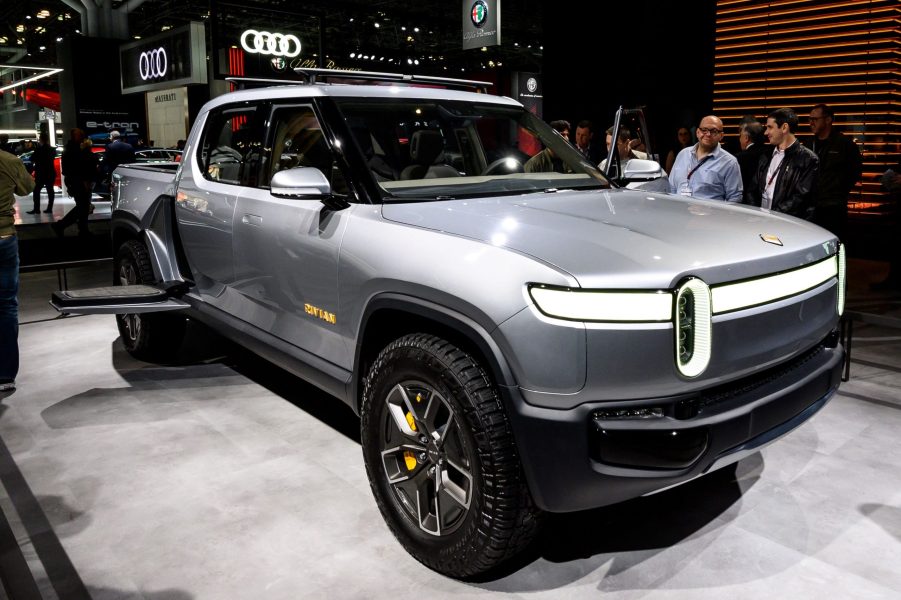 A silver Rivian R1T inside a building.