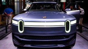 A gray Rivian R1T electric truck is on display.