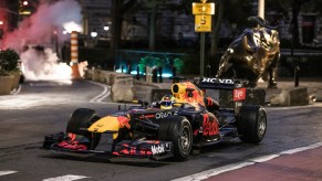 This is a publicity photo of Red Bull Racing's RB7 F1 car in New York City. The driver hooned around Manhattan, revving the engine and even drifting into a parking spot. | Red Bull Racing