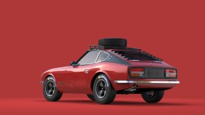 The rear 3/4 view of Sung Kang's red-and-black 1971 'Doc Z' Datsun 240Z