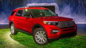 A red Ford Explorer is on display.