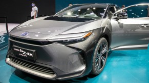 A silver 2022 Toyota bZ4X electric SUV is on display.