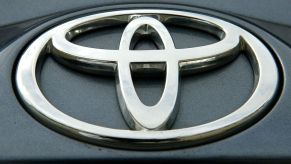 Toyota logo on a black background as found on a Toyota Land Cruiser.