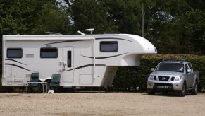 Truck Parked Next To Fifth-Wheel Camper