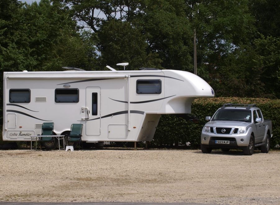 Truck Parked Next To Fifth-Wheel Camper