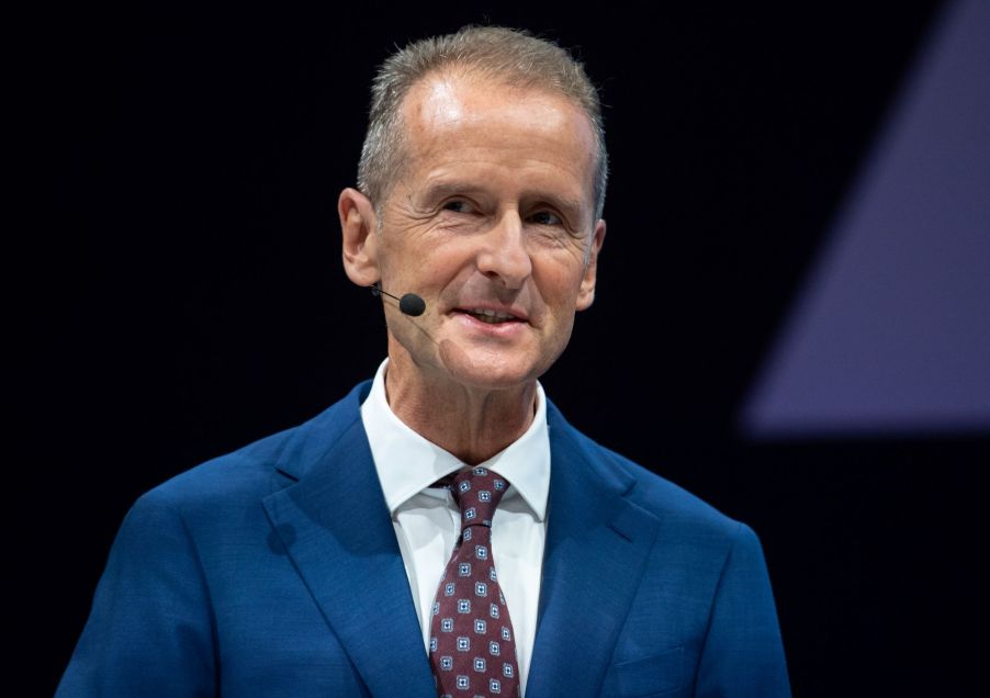 Volkswagen's CEO dressed in a blue suit with a red tie with diamonds on it.