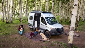 Winnebago camper van set up outdoors